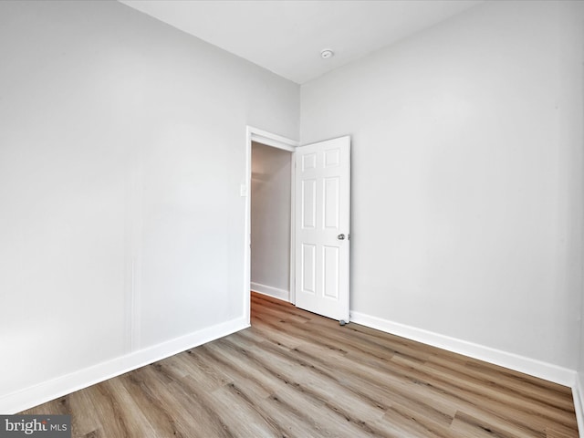 spare room with light wood-type flooring