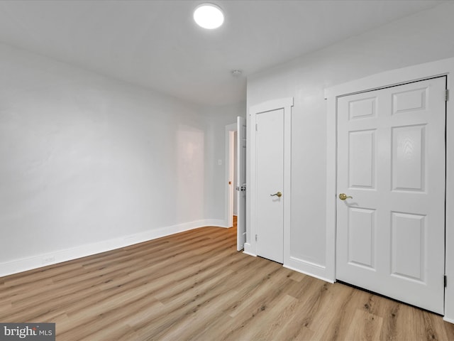 unfurnished bedroom with light hardwood / wood-style floors