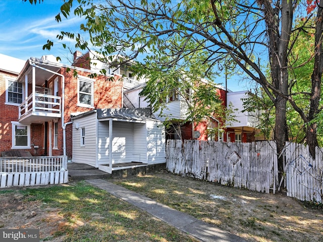 view of front of property with a balcony