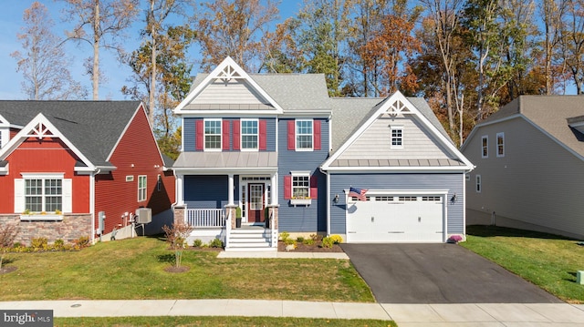 craftsman-style home with covered porch and a front lawn