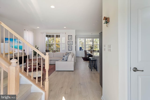 living room with light hardwood / wood-style flooring