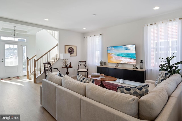 living room with light hardwood / wood-style flooring and plenty of natural light