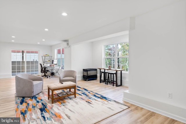 living room with light hardwood / wood-style flooring