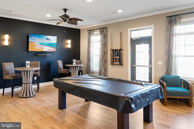 playroom featuring crown molding, plenty of natural light, light wood-type flooring, and billiards