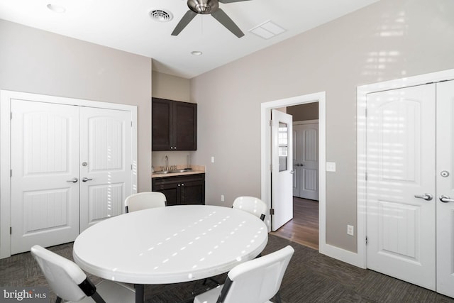 dining room with sink and ceiling fan