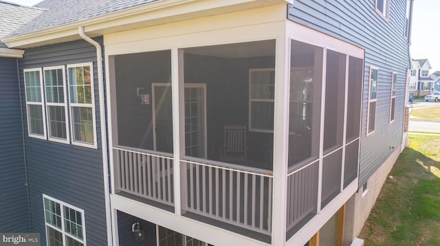 view of side of home featuring a sunroom