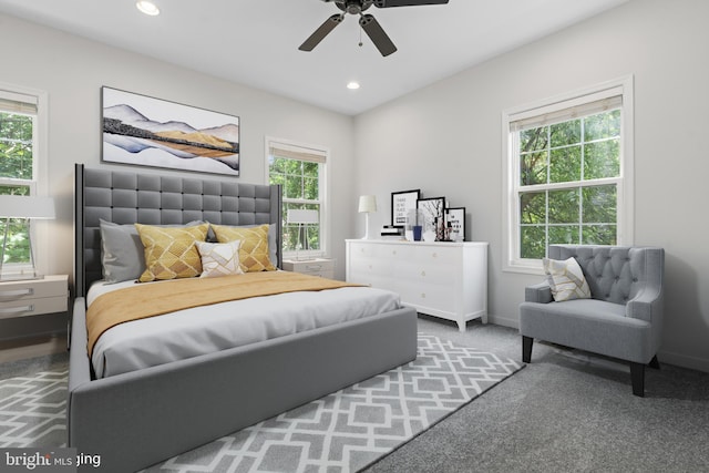 bedroom with multiple windows, carpet floors, and ceiling fan