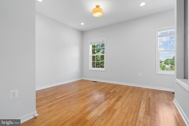 empty room with light wood-type flooring