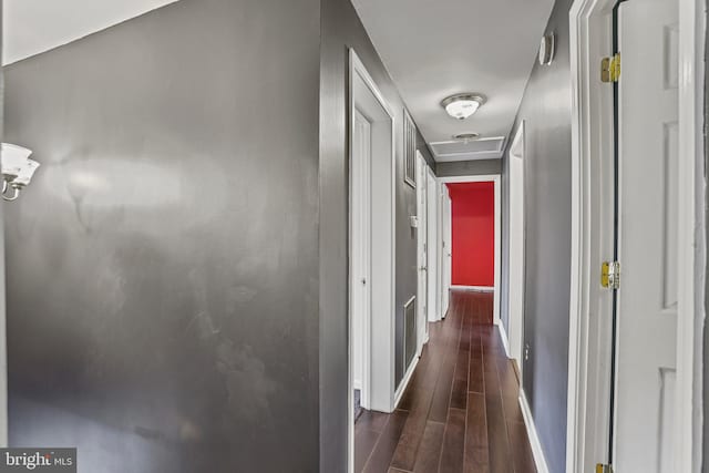 corridor featuring dark hardwood / wood-style floors