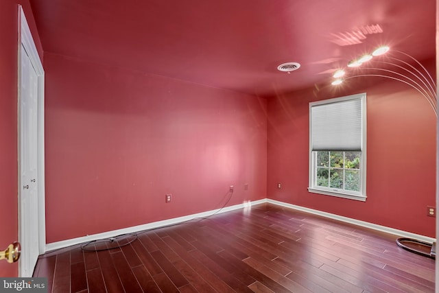 spare room featuring hardwood / wood-style floors