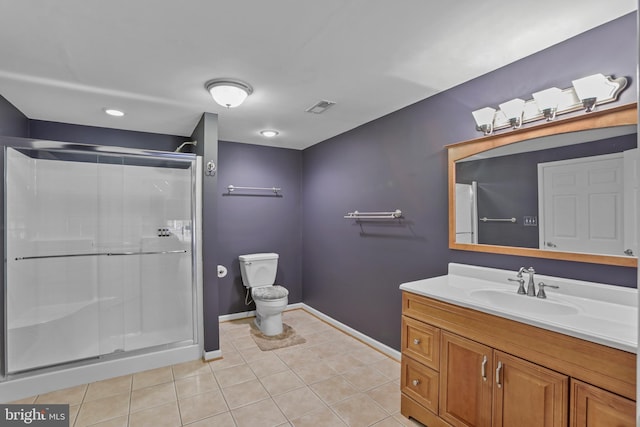 bathroom featuring vanity, tile patterned flooring, and a shower with shower door