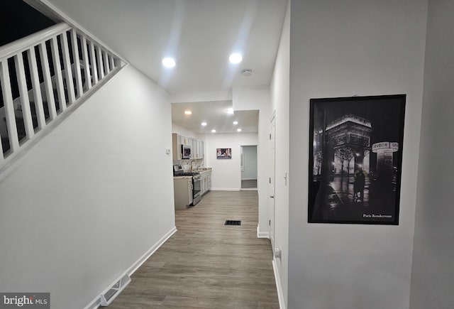 hall with wood-type flooring