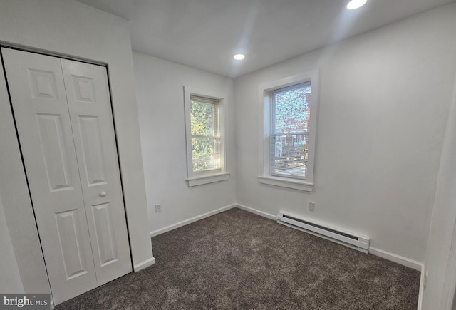 1005 N Spruce St, Wilmington, DE 19801 - empty room with baseboard heating, dark colored carpet, baseboards, and recessed lighting