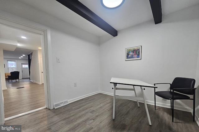 office with beamed ceiling and dark hardwood / wood-style floors