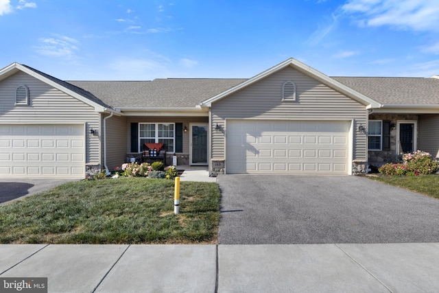 ranch-style home with a garage, driveway, stone siding, and a porch