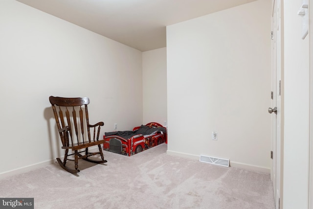 sitting room with light colored carpet