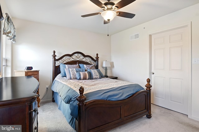 bedroom with light carpet and ceiling fan