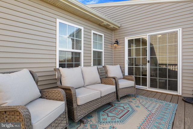 wooden terrace featuring outdoor lounge area