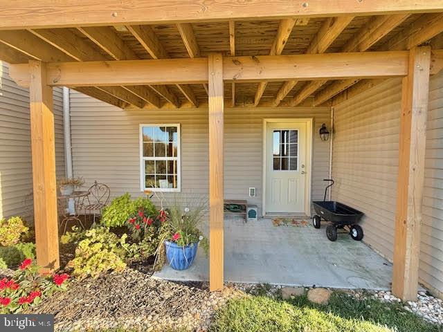 entrance to property with a patio area