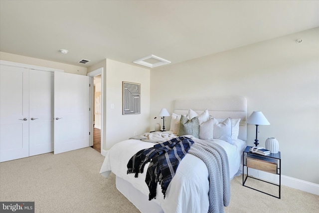 carpeted bedroom with a closet