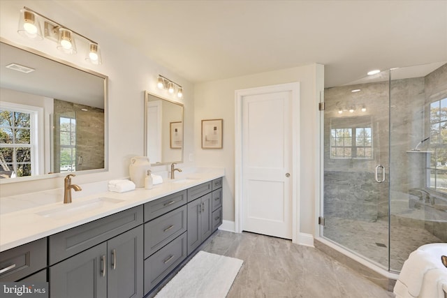 bathroom with vanity and an enclosed shower