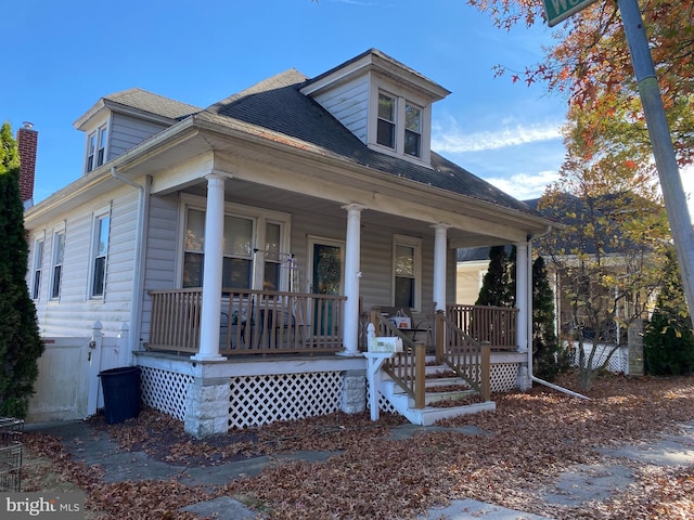 105 Pine St, Mount Holly, NJ 08060 - view of front facade with a porch and roof with shingles