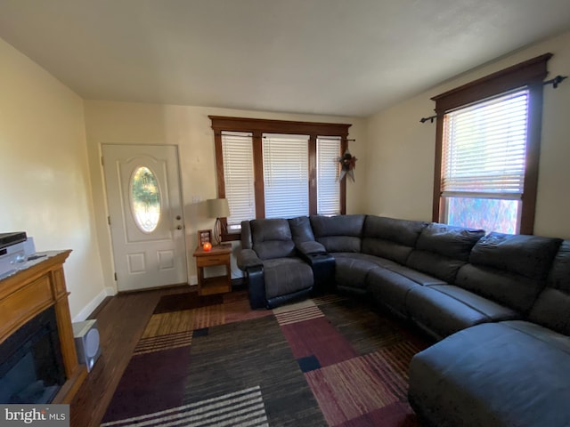 105 Pine St, Mount Holly, NJ 08060 - living room featuring healthy amount of natural light, wood finished floors, baseboards, and a glass covered fireplace