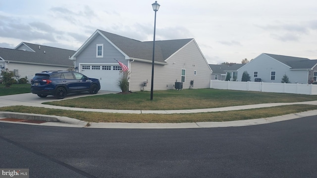 view of front of house with a front lawn and central AC unit