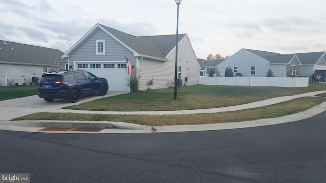 view of front of house with a front yard and a garage