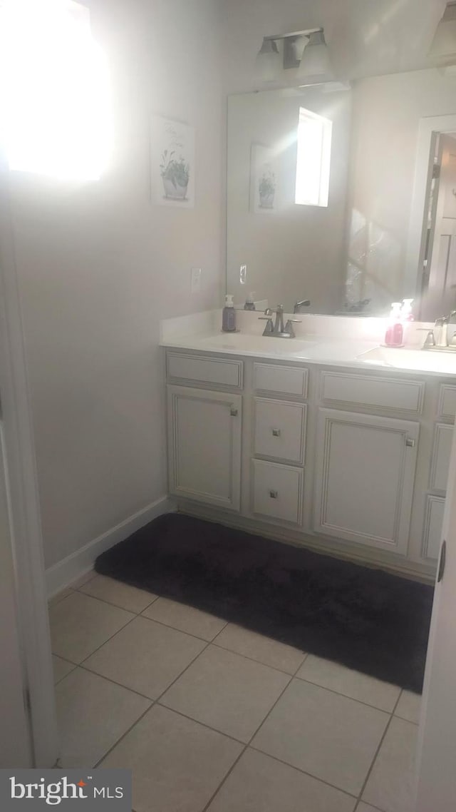 bathroom with vanity and tile patterned flooring