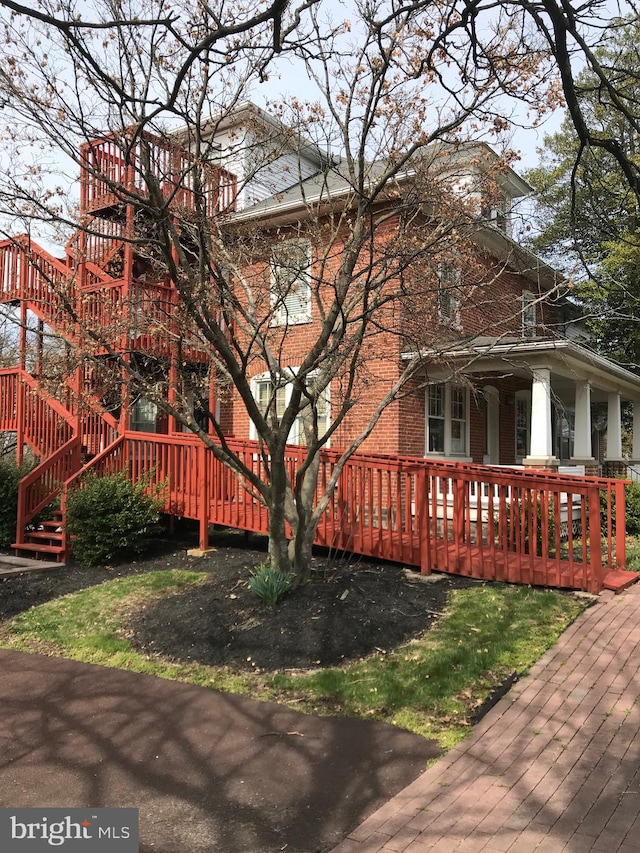 view of property exterior with a deck