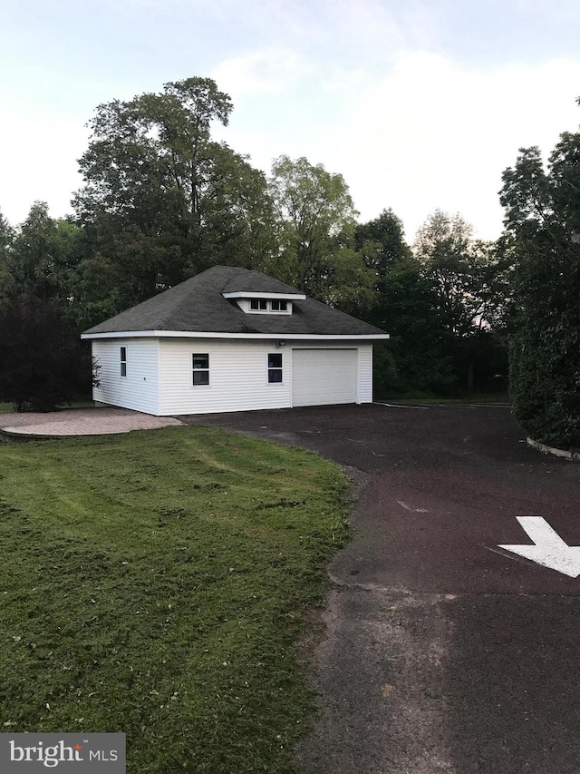 garage with a yard