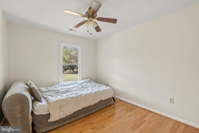 bedroom featuring ceiling fan and light hardwood / wood-style flooring