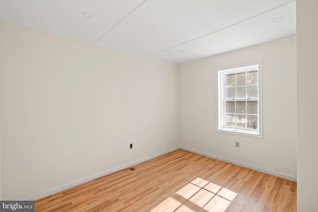 spare room featuring light wood-type flooring