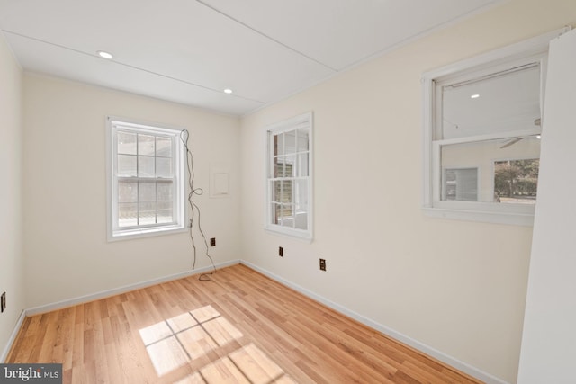 spare room with light hardwood / wood-style flooring