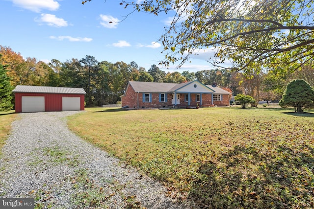 single story home featuring a front yard, an outdoor structure, and a garage