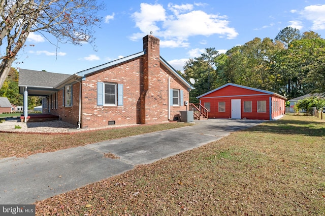 view of side of property with a lawn