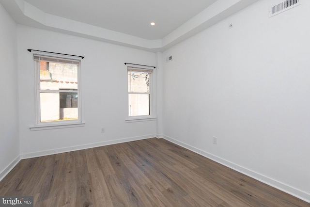 empty room featuring dark hardwood / wood-style floors