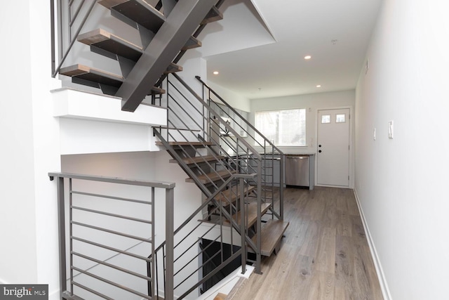 stairway featuring hardwood / wood-style flooring