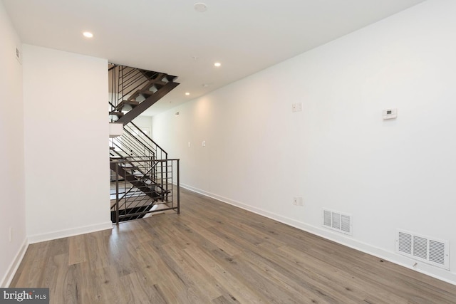 unfurnished living room with wood-type flooring