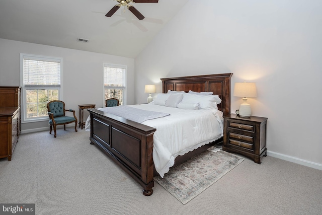 carpeted bedroom featuring high vaulted ceiling and ceiling fan