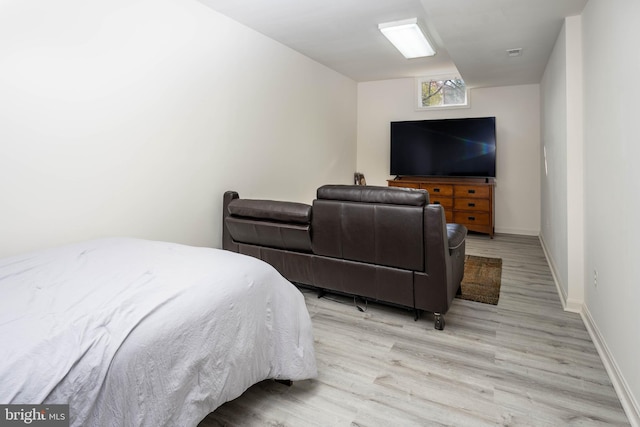 bedroom with light hardwood / wood-style flooring