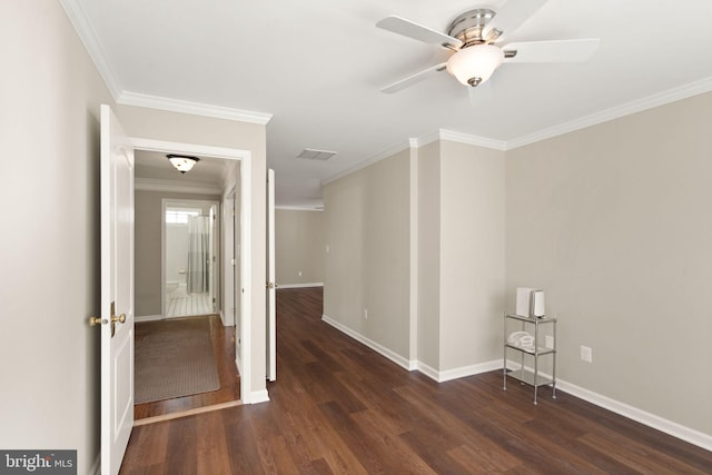 spare room with ceiling fan, crown molding, and dark hardwood / wood-style flooring