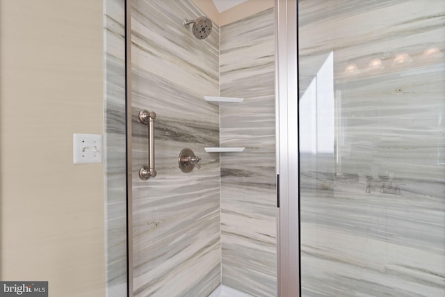 bathroom with a tile shower