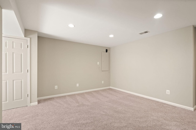 empty room featuring light colored carpet