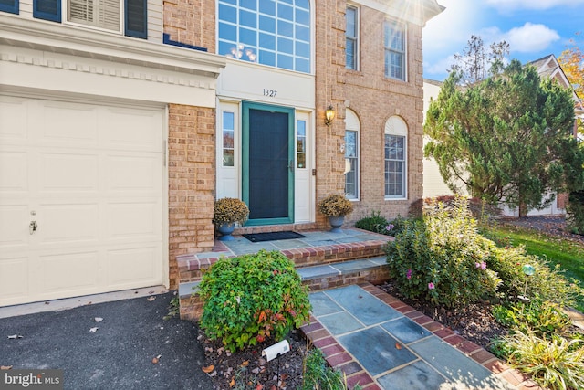 entrance to property featuring a garage