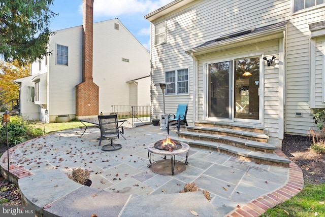 view of patio featuring a fire pit