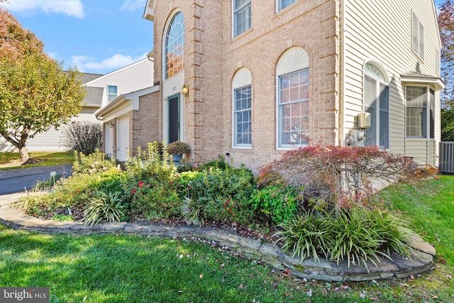 view of home's exterior featuring a lawn