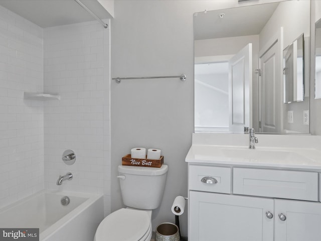 full bathroom featuring toilet, tiled shower / bath combo, and vanity