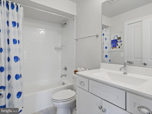 full bathroom with toilet, hardwood / wood-style flooring, vanity, and shower / tub combo